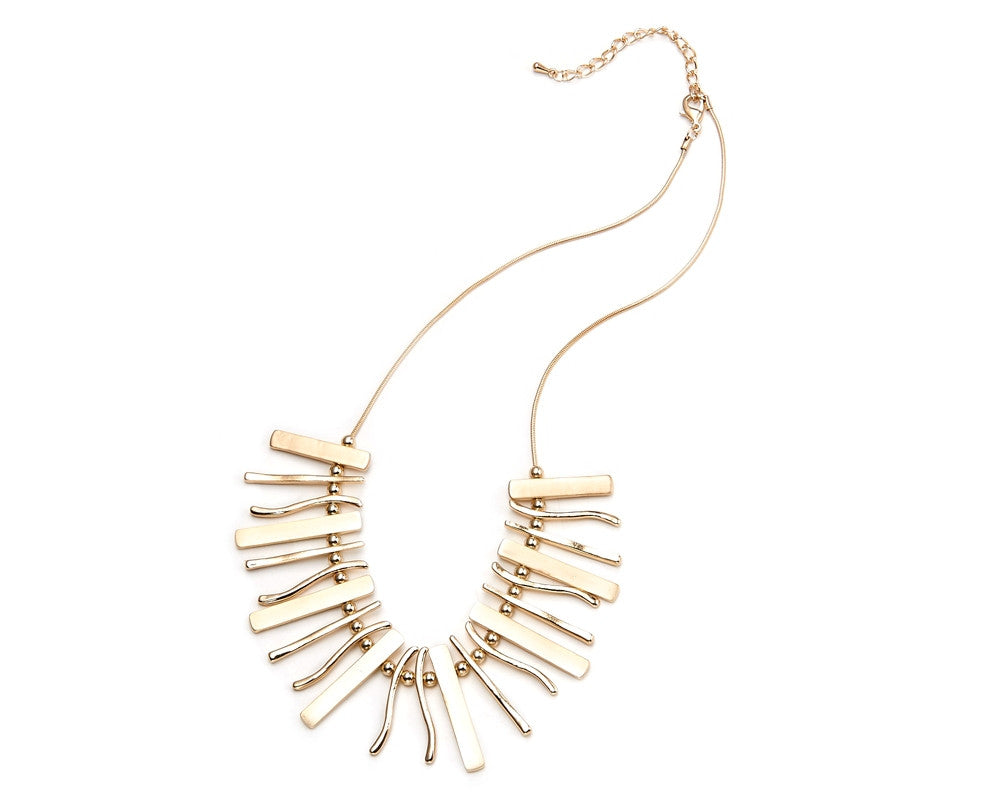 Gold statement necklace and bracelet