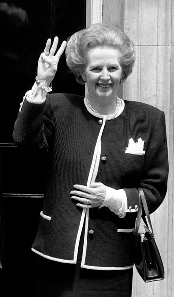 Margaret Thatcher is wearing cufflinks